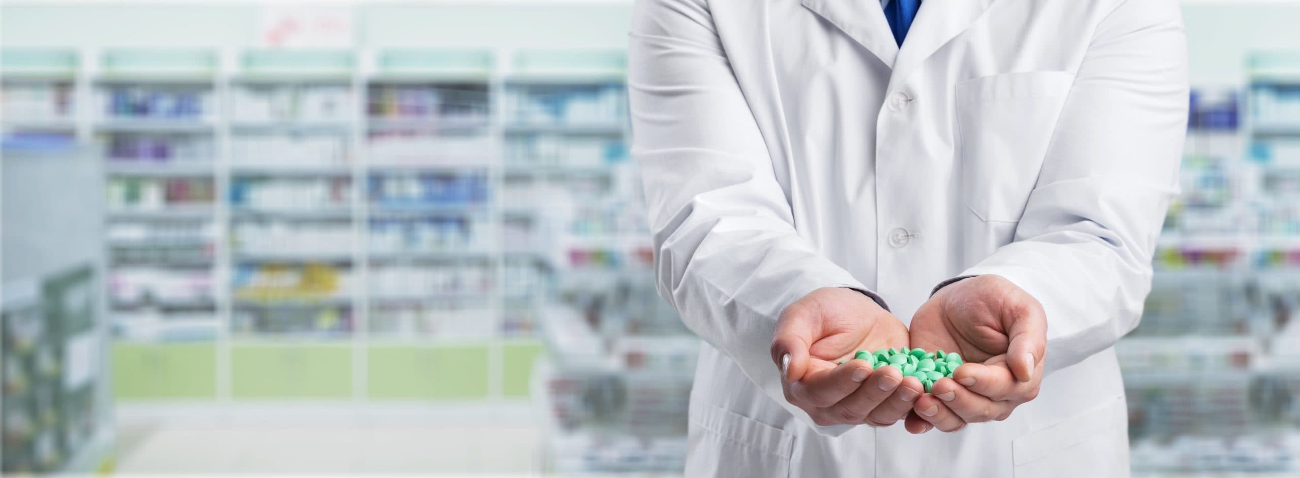Doctor holding a pill