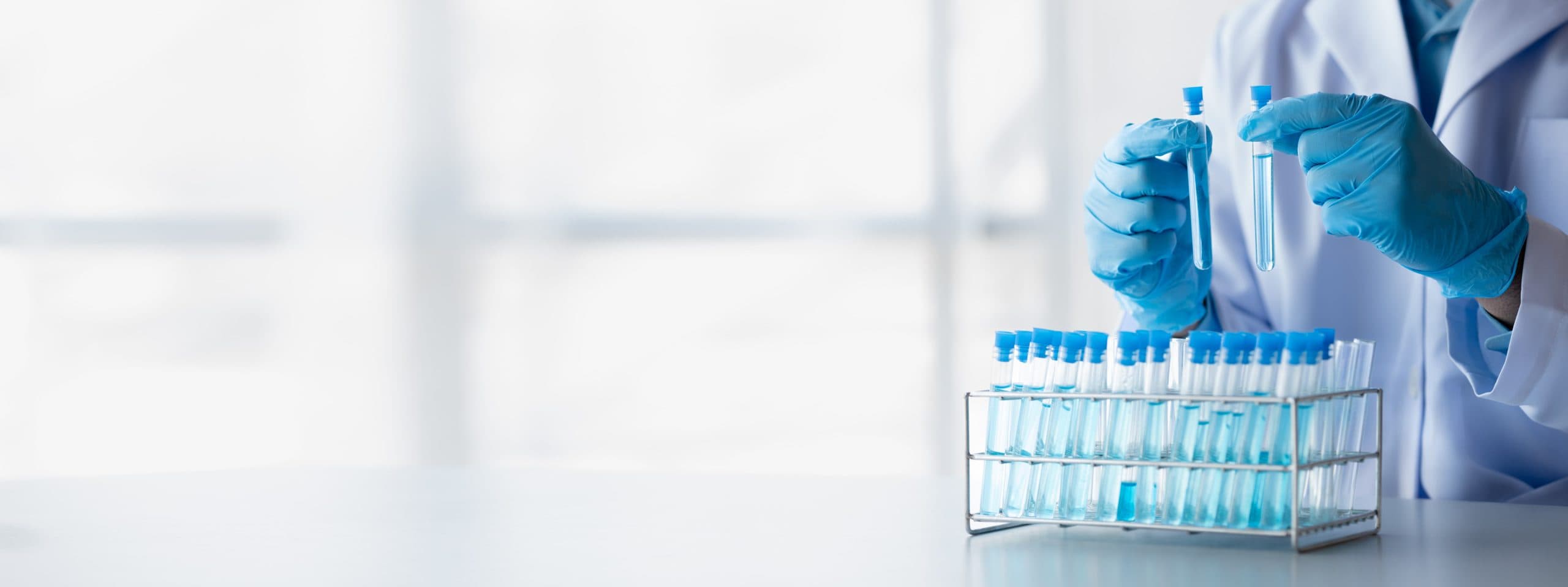 Lab practitioner examining a blood sample