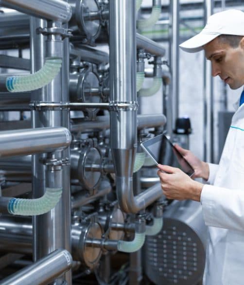 Technologist setting up a production line with a tablet